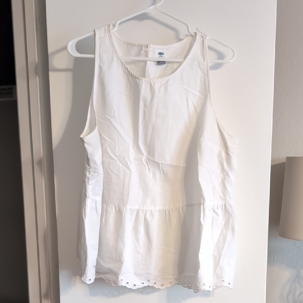 White peplum Sleeveless Top with eyelet detail on bottom